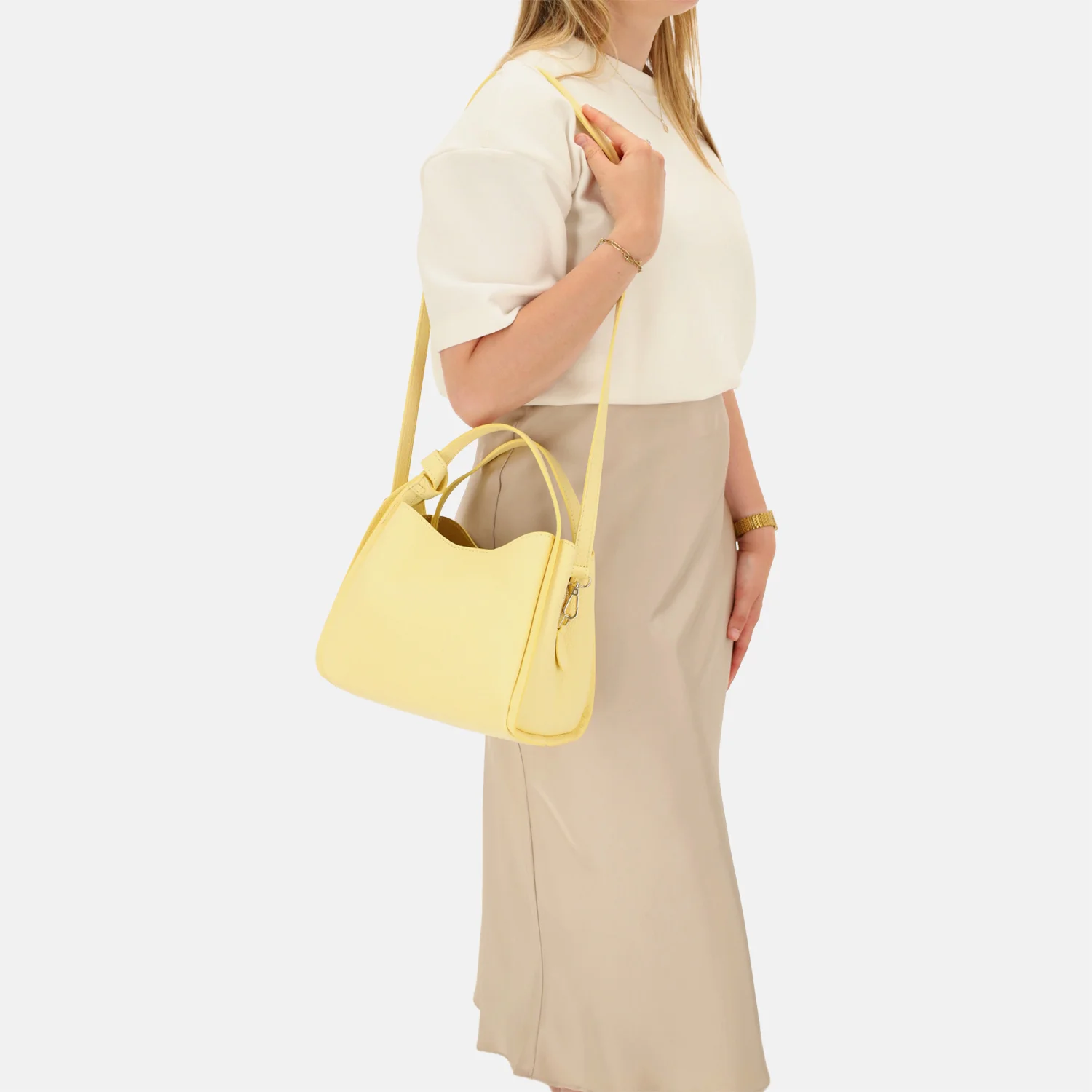 Charm London Knott handtas zachtgeel bij Duifhuizen